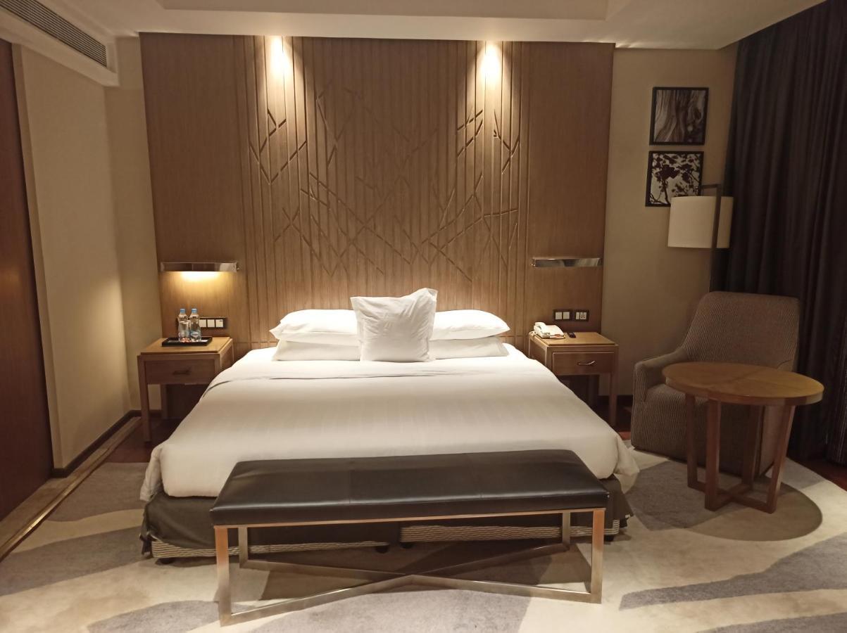 班加罗尔欢迎酒店 外观 照片 A bedroom at the hotel